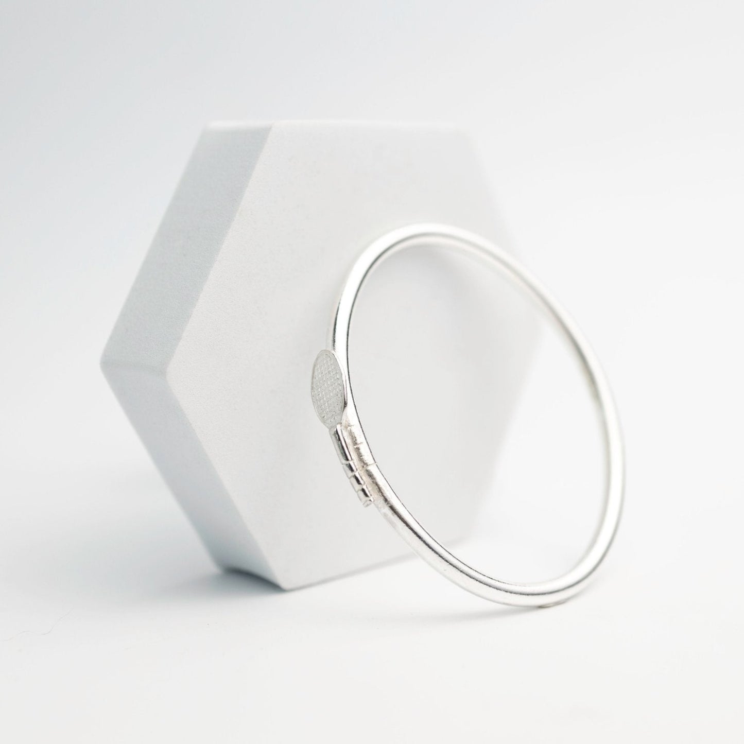 custom made sterling silver tennis bangle with tennis racket