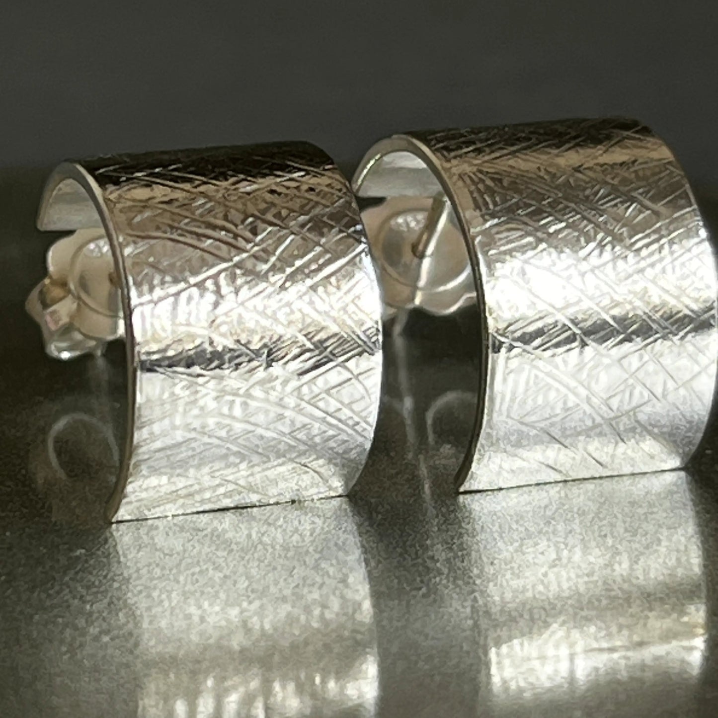 wide silver earrings cris cross pattern
