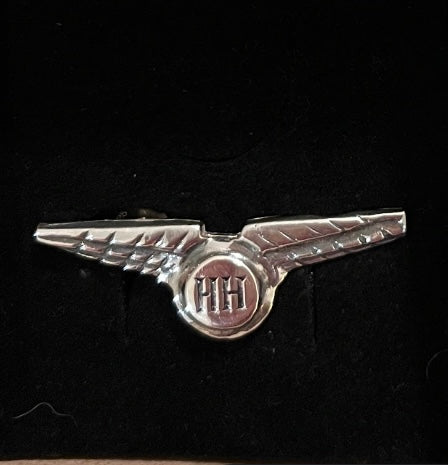 Sterling silver handmade pilot wings made in emblem with a logo on a black background made in Dublin