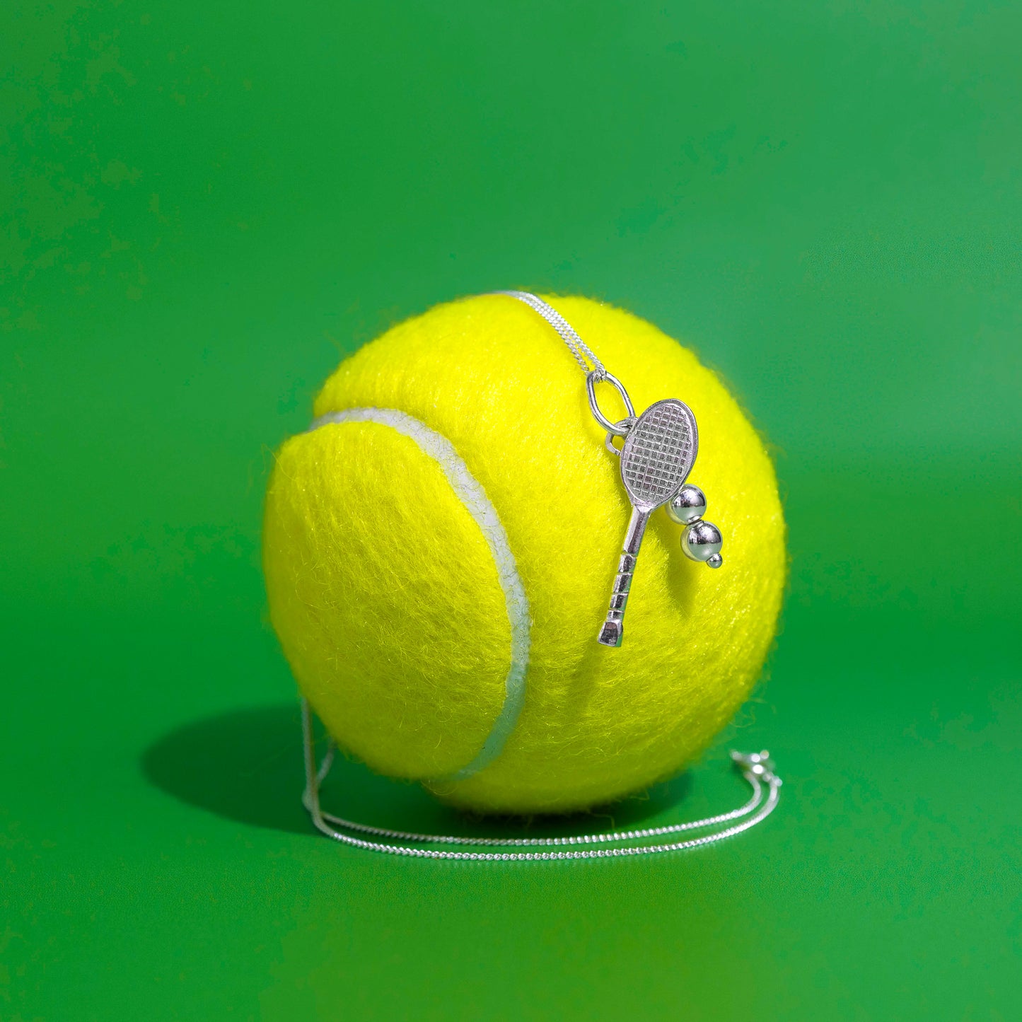 Tennis ball with sterling silver tennis pendant