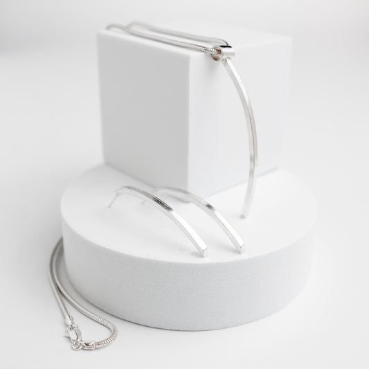 Sterling silver pendant necklace. Clean line classy pendant shaped like a narrow lond piece of 2mm square silver on a silver snake chain