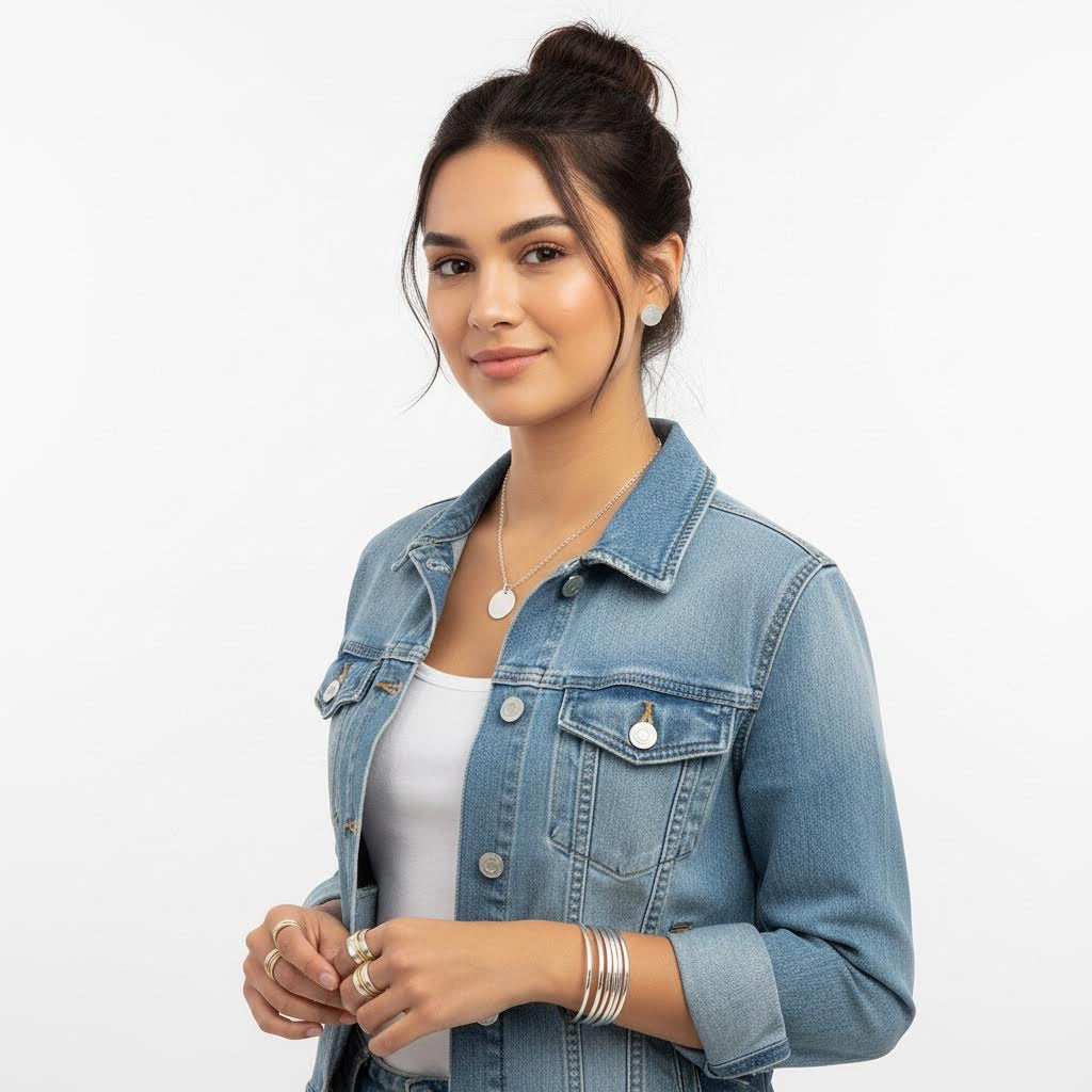 Woman wearing a denim jacket on a white background