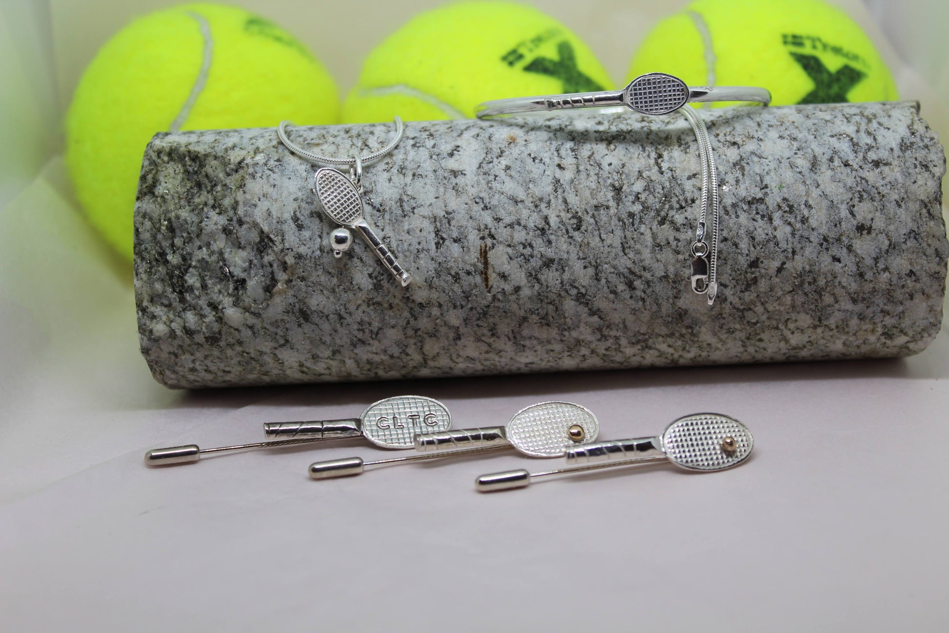 Handmade hand crafted sterling silver tennis bracelet bangle pictured with yellow tennis ball . Other items also available in the picture. Hit with me tennis necklace and tennis racket stick pins 