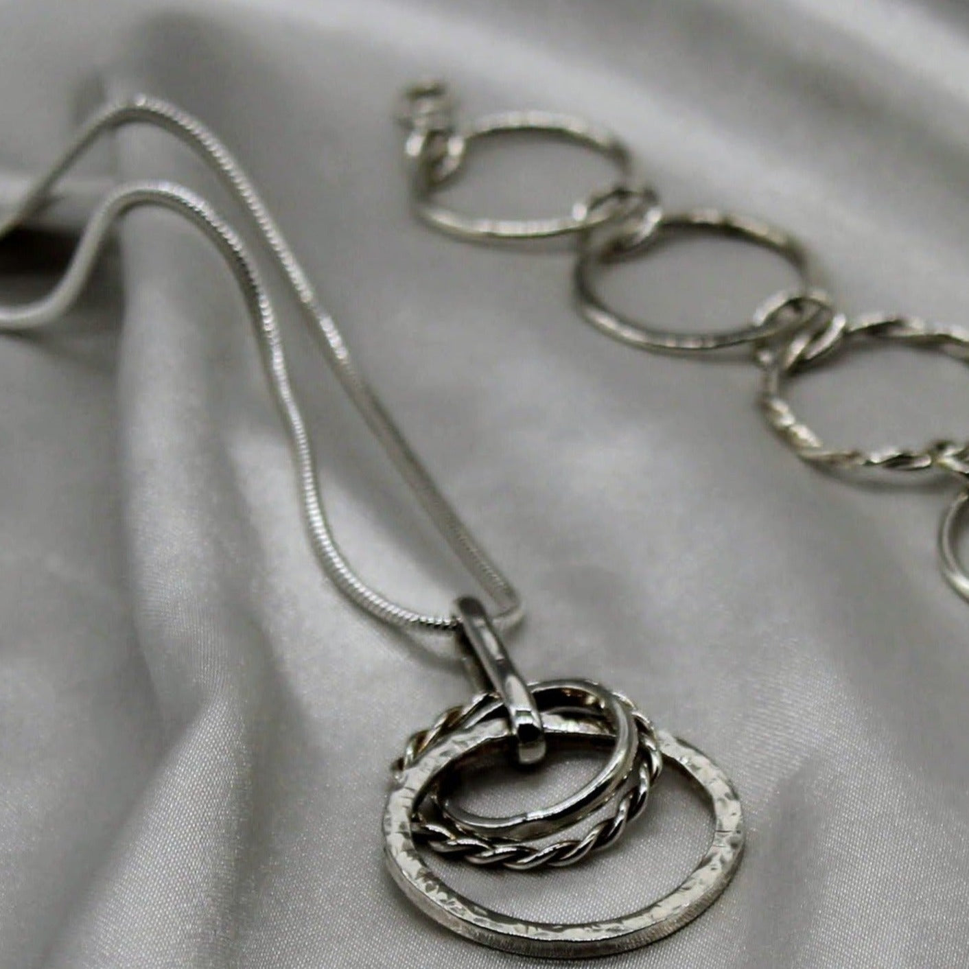pendant necklace silver three circles various sizes linked together