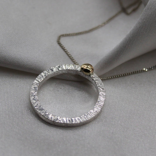 beautiful bright cut circle of silver with9ct gold ball pendant necklace