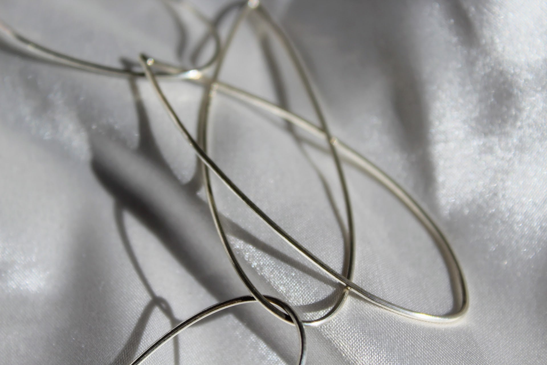 sterling silver necklace on a grey silk background