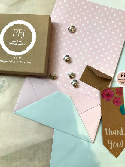 PFj logo on Eco friendly box - pink and white polka dot wrapping paper and silver hearts