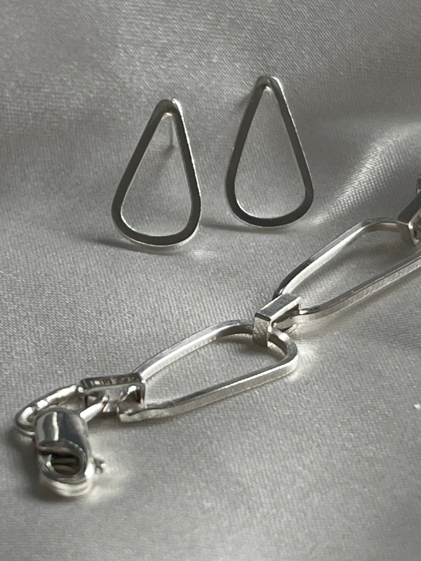 droplet shaped silver earrings with waterflow handmade silver bracelet